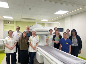 The nuclear medicine team with one of the new machines.