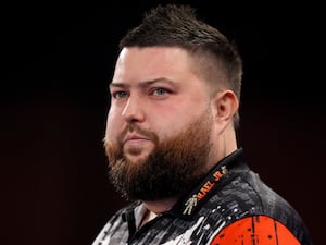 Michael Smith at the oche