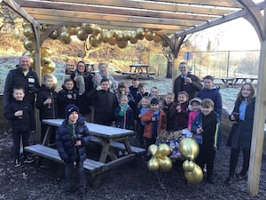 Pupils toast the opening of their wellbeing garden with (from left) Clive Heath, Vicki Harrison, Julia Bell and James Price

