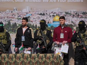 Two Israeli captives are escorted by Hamas and islamic Jihad fighters