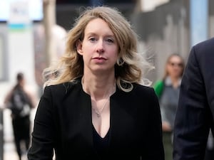 Elizabeth Holmes outside a court