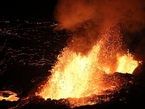 Lava spewing from Haleumaumau Crater at the summit of Kilauea volcano inside Hawaii Volcanoes National Park, Hawaii