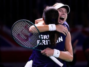 Katie Boulter, right, celebrates victory over Canada’s Leylah Fernandez with captain Anne Keothavong