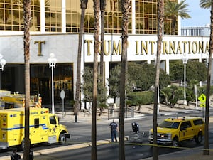 Clark County Fire Department crews work outside Trump International Hotel