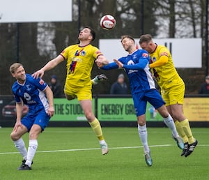 Mitch Clarke beaten to the header.