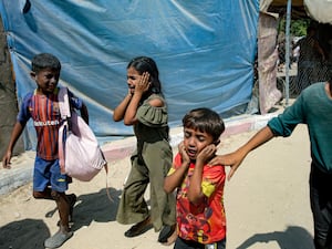 Palestinian children are evacuated from a site hit by an Israeli strike on Khan Younis, southern Gaza Strip