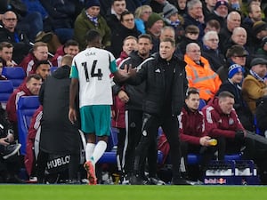 Alexander Isak shakes Eddie Howe's hand on the touchline