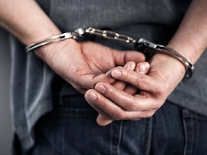 A person in handcuffs