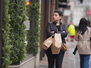 A woman carrying shopping bags