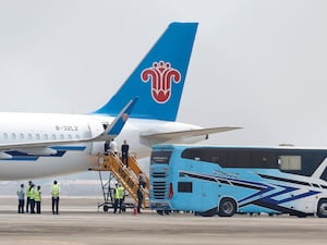 Chinese nationals, believed to have worked at scam centres in Myanmar, board a plane at Thailand’s Mae Sot International Airport before being sent back to China