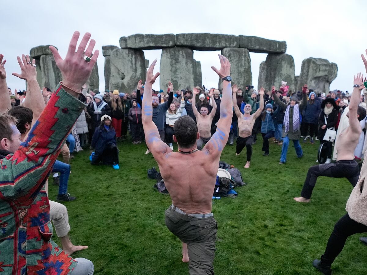 Thousands greet dawn with cheers at Stonehenge to mark winter solstice