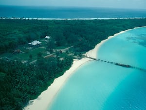 An aerial view of roads, buildings and forest on Diego Garcia