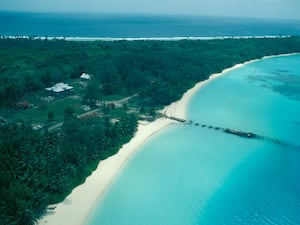 An aerial view of roads, buildings and forest on Diego Garcia