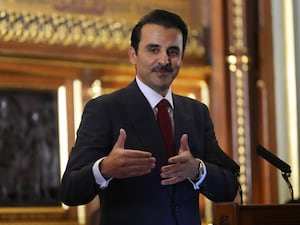 The Emir of Qatar Sheikh Tamim bin Hamad Al Thani gestures during a tour of the Palace of Westminster, London during the state visit to the UK