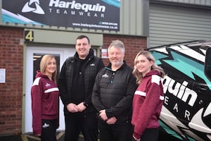 Business owner Liam Barnett (second left) with the Leasha Griffiths, Jason Roberts and Keri Mayne at Stafford based Harlequin Teamwear.