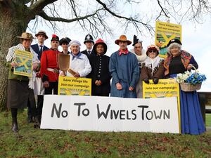 People dressed as Camberwick Green characters mounting a protest