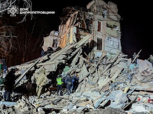 Firefighters at a site destroyed by a Russian attack in Kryvyi Rih, Ukraine