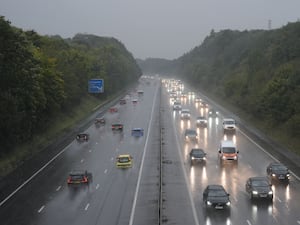 Traffic on the M3 motorway near Basingstoke during wet weather