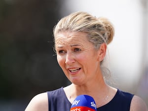 Charlotte Edwards talking into a microphone