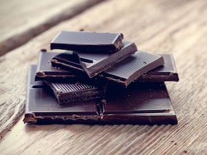 Squares of dark chocolate on a board