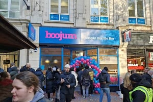 People queue outside Boojum for free burrito