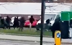 Footage shows the youths running through roads towards each other.