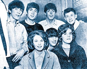 The Beatles with some young fans in November, 1963