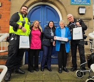 Marjorie (blue coat), a beloved former cleaner at Rugeley Police Station, returned to visit her colleagues after 30 years