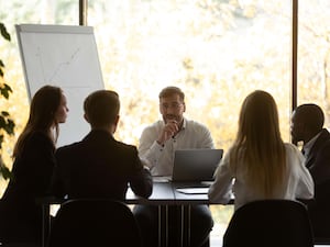 Chief executive makes presentation for investors during boardroom meeting