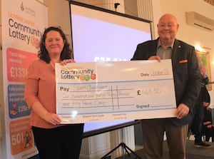 Esther Allen, CEO of Spark receives a cheque from Councillor Richard Cox on behalf of Lichfield District Community Lottery. 