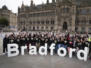 Volunteers at City Park in Bradford join together to celebrate the launch of Bradford 2025 UK City of Culture