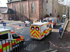 Rescue vehicles are seen near a crime scene in Aschaffenburg, Germany