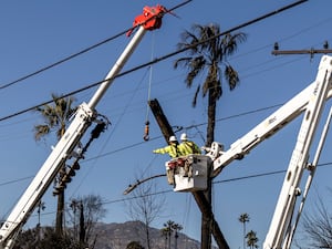 Energy power workers working on a power line