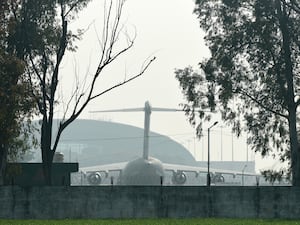 A US military plane which carried deported Indian immigrants is parked at the international airport in Amritsar