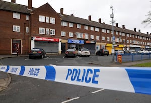 Blue police tape in place on Redwood Road