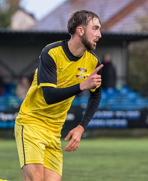 Callum Knowles celebrates his goal for Whitchurch Alport (picture by Jim Wall)