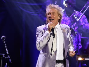 Rod Stewart performing on stage