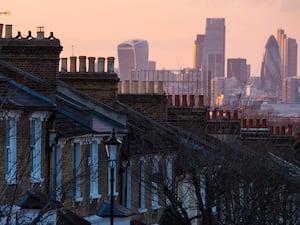 Terraced houses in the forefront with the City of London in the background