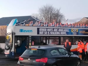 Double-decker bus with the roof missing