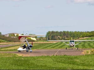 A microlight and a small plane at Fife Airport