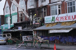 Emergency services at the scene of a fire at a mixed commercial and residential premises on Stratford Road in Sparkhill, Birmingham. Photo: Jacob King/PA Wire