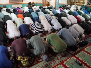 Muslims praying at a mosque