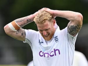 Ben Stokes walks off with his hands on his head