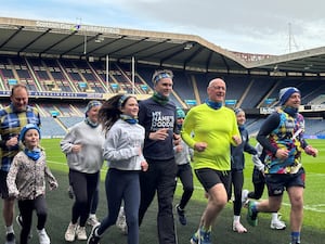 John Swinney goes for a run at Murrayfield