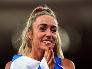 Eilish McColgan smiles as she puts her hands to her chin