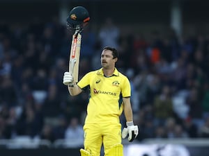 Travis Head celebrates his century