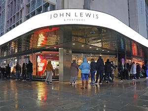 Customers outside the John Lewis store in London's Oxford Street