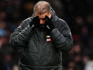 Ange Postecoglou puts his head in his hands