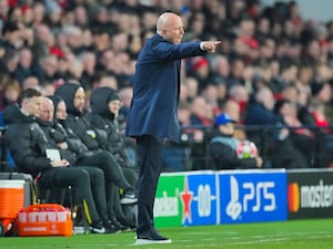 Liverpool head coach Arne Slot points from the touchline