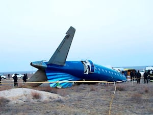 Part of the Azerbaijan Airlines’ Embraer 190 lies on the ground near Aktau airport in Kazakhstan